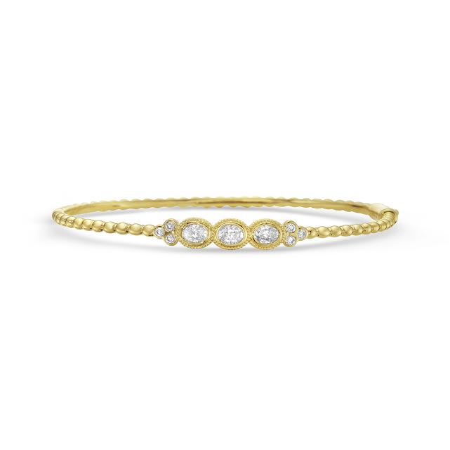 14ky 6mm bangle with 9 diamonds oval & round tw 0.71ct