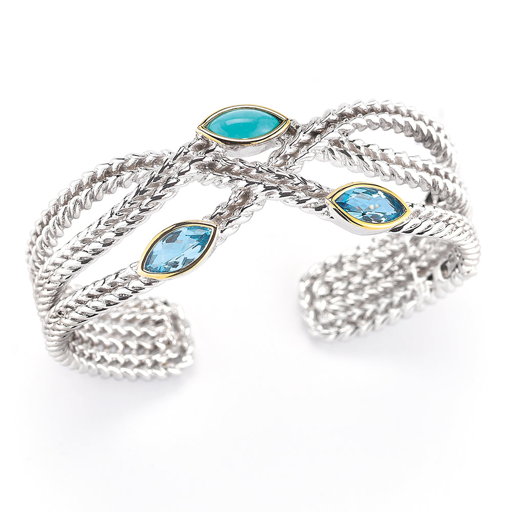 STERLING SILVER AND 14K HINGED BANGLE WITH BLUE TOPAZ