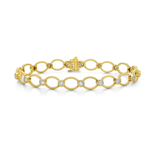 14K 9X7MM OVAL LINK BRACELET WITH 17 DIAMONDS 0.75 CT 7.25 INCHES WRIST