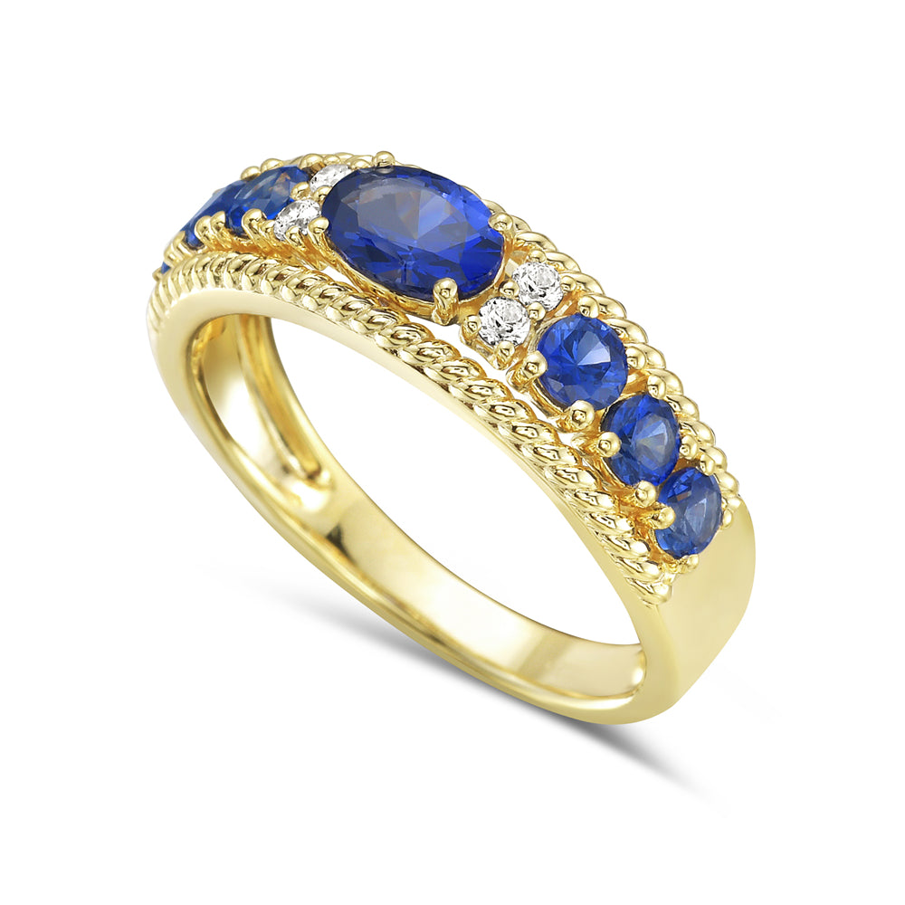 14KY ring with 7 medium blue sapphires 1.4ct tw and 4 diamonds 0.08ct tw 5.5