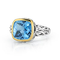 STERLING SILVER RING WITH A 14KY SQUARE BEZZEL SET WITH BLUE TOPAZ  AND  0.04CT DIAMONDS.