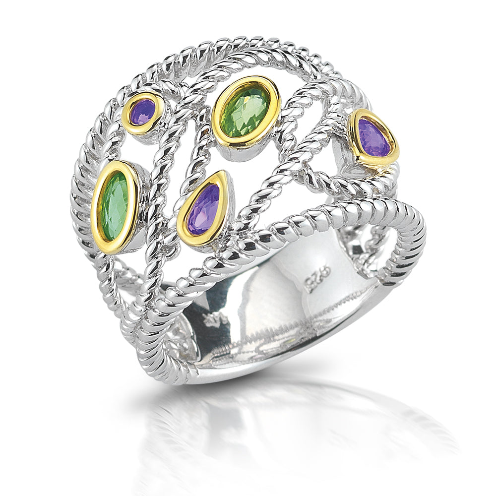 STERLING SILVER  RING , WITH IN GOLD BEZEELS SET WITH  AMETHYST AND PERIDOT .